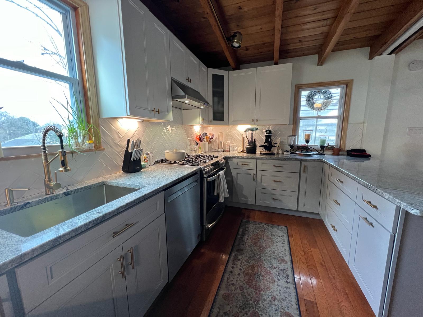Kitchen renovation in Philadelphia with farmhouse sink and white shaker cabinets