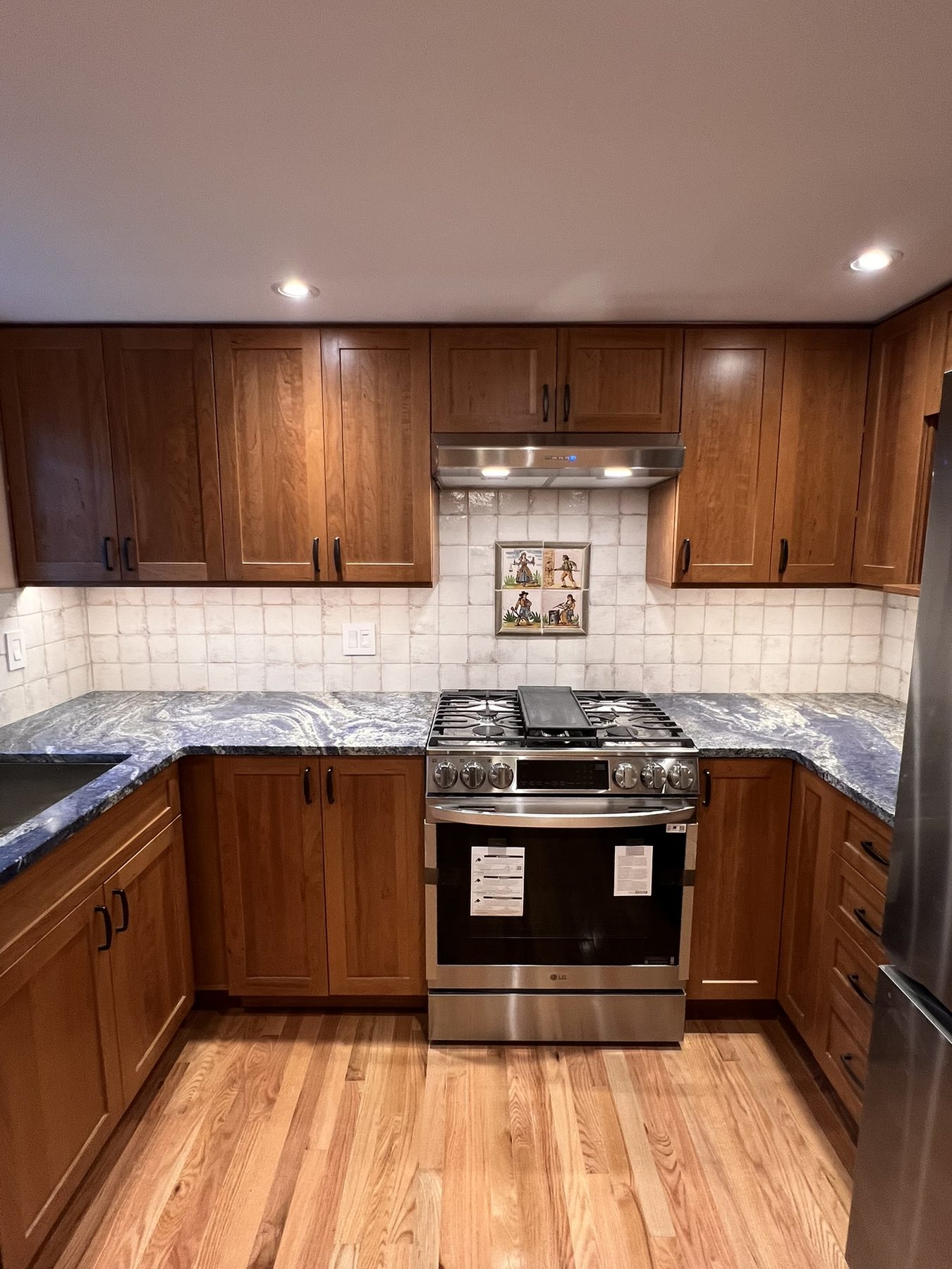 Full kitchen renovation in Philadelphia with hardwood floors and updated cabinetry